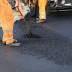 Workers,Making,Asphalt,With,Shovels,At,Road,Construction