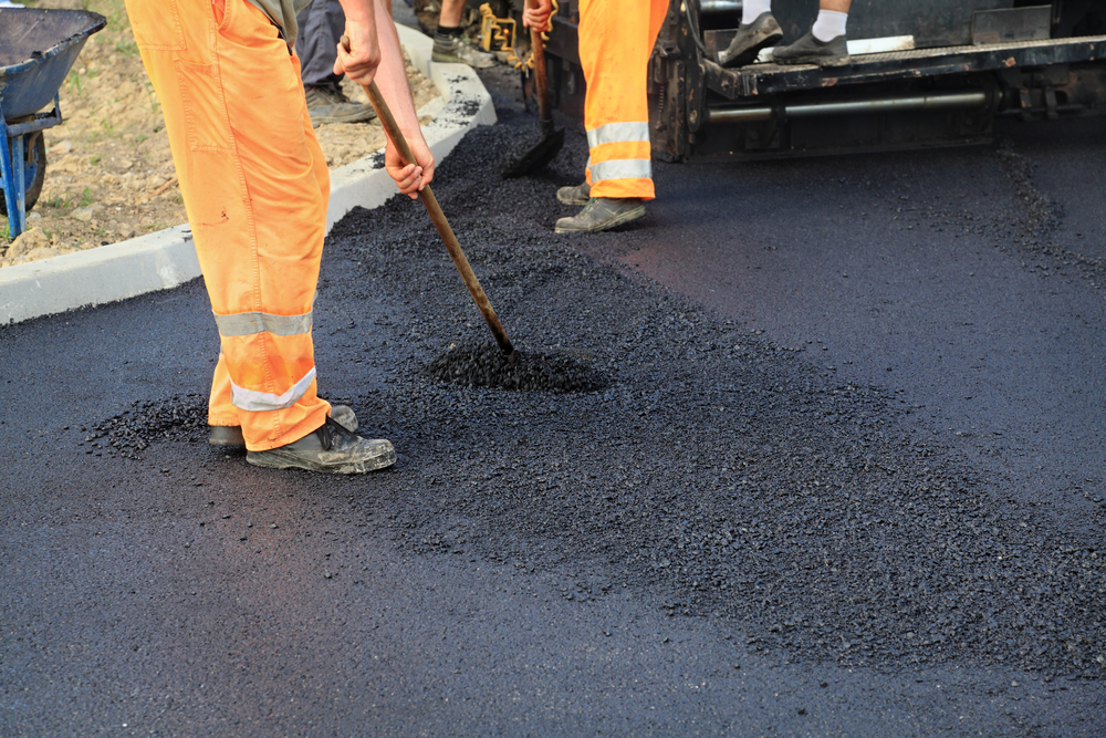 Workers,Making,Asphalt,With,Shovels,At,Road,Construction