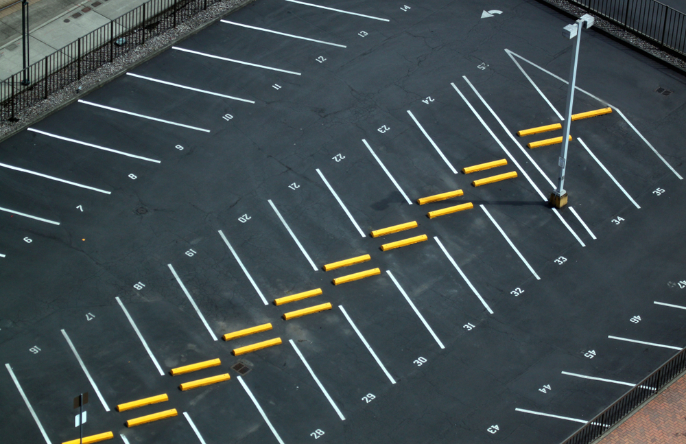 Abstract,Aerial,Shots,Of,Parking,Lot,With,White,And,Yellow