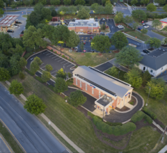 Aerial drone view of freshly paved commercial parking lot at dusk by Maryland Asphalt LLC