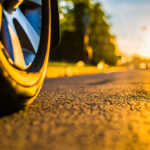 Sunny,Day,In,A,City,,Headlights,Of,Approaching,Cars,,The